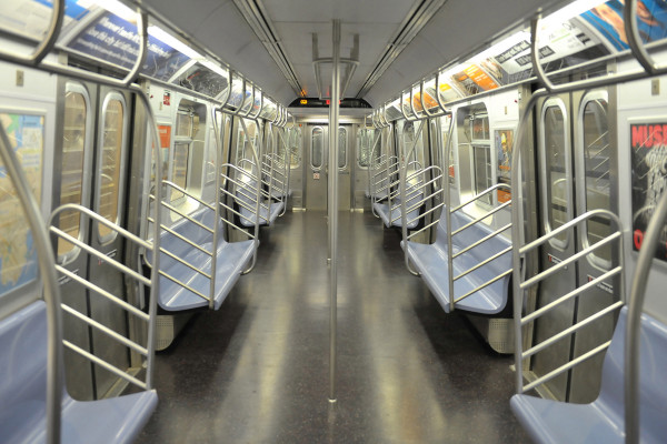 Photo of an empty subway train car interior.